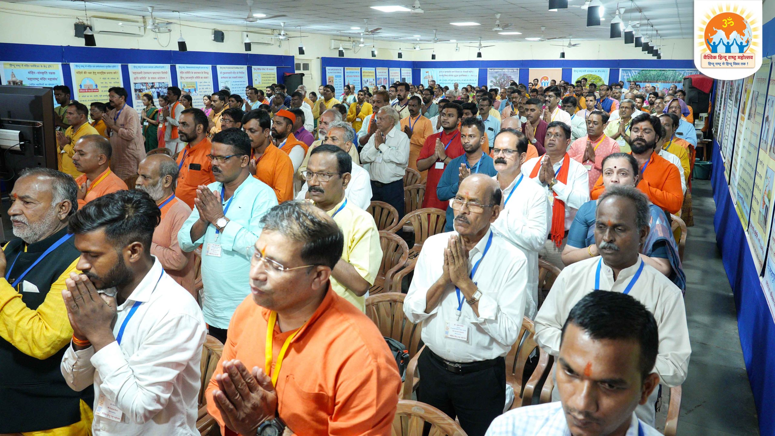 Devout Hindus paying obeisance to motherland with joined palms and a sense of surrender while singing the National song of India - 'Vande Mataram'