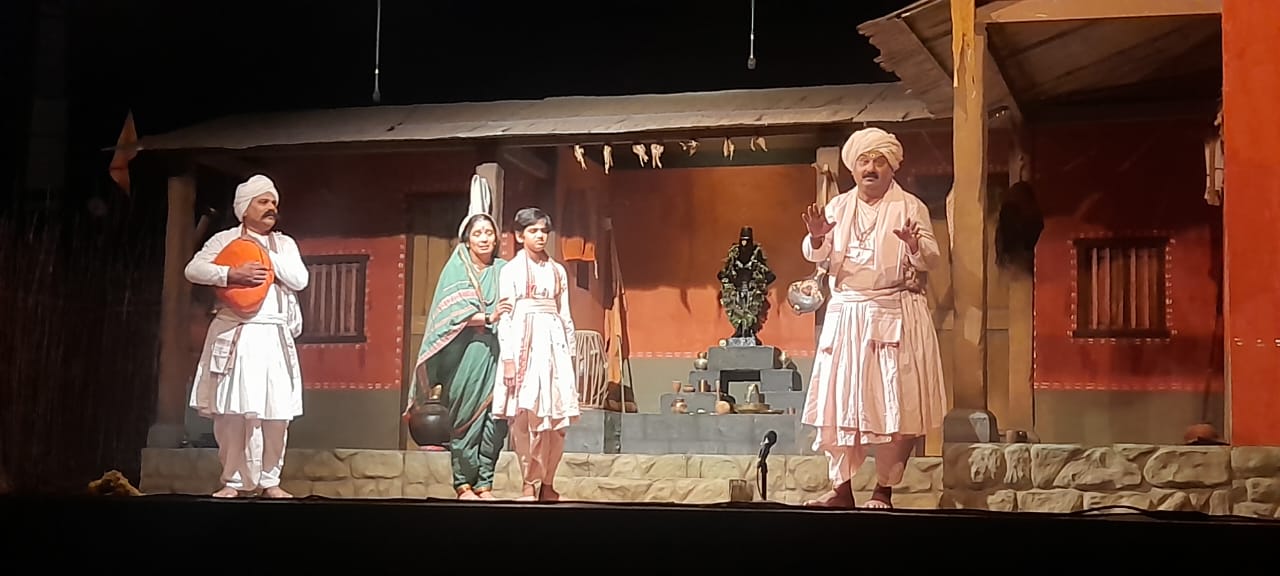 Characters in the play dressed in Warkari attire